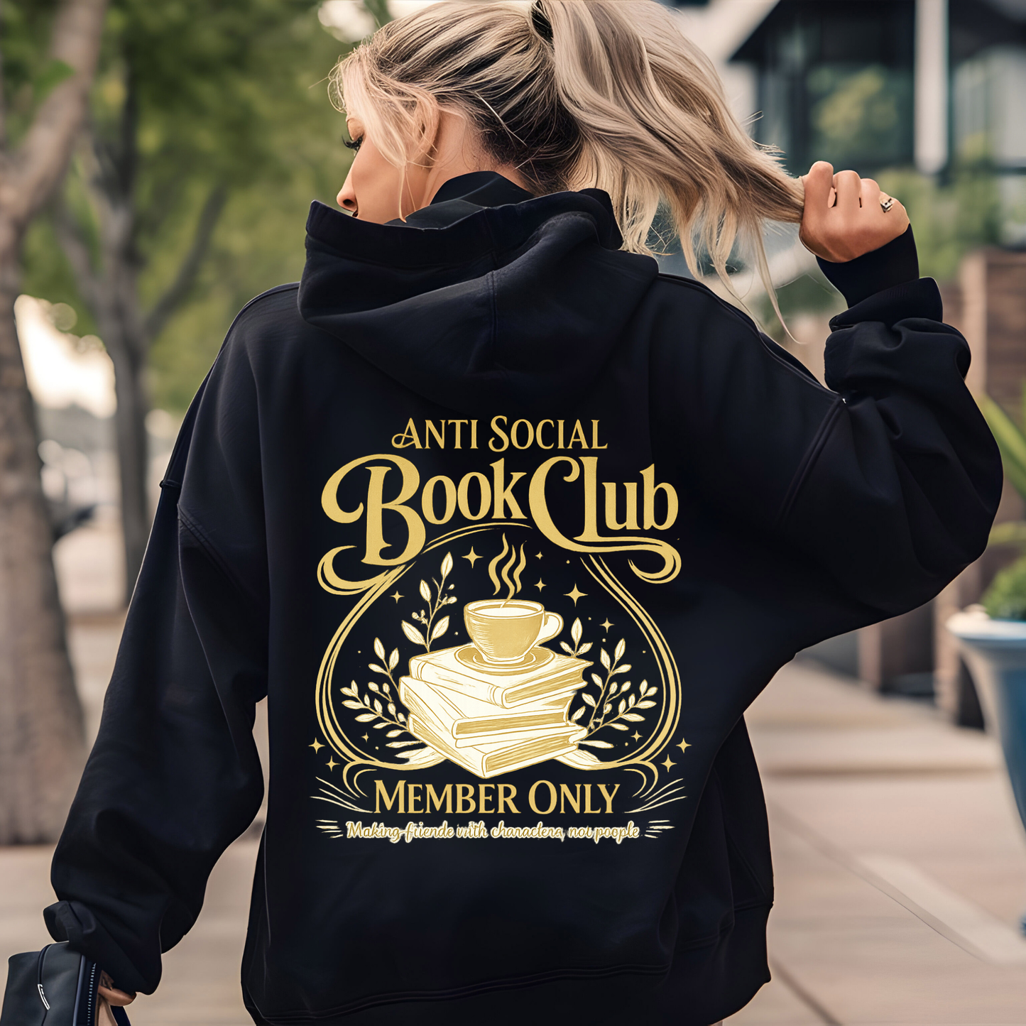 Person wearing a black hoodie with 'Anti Social Book Club' design on the back.