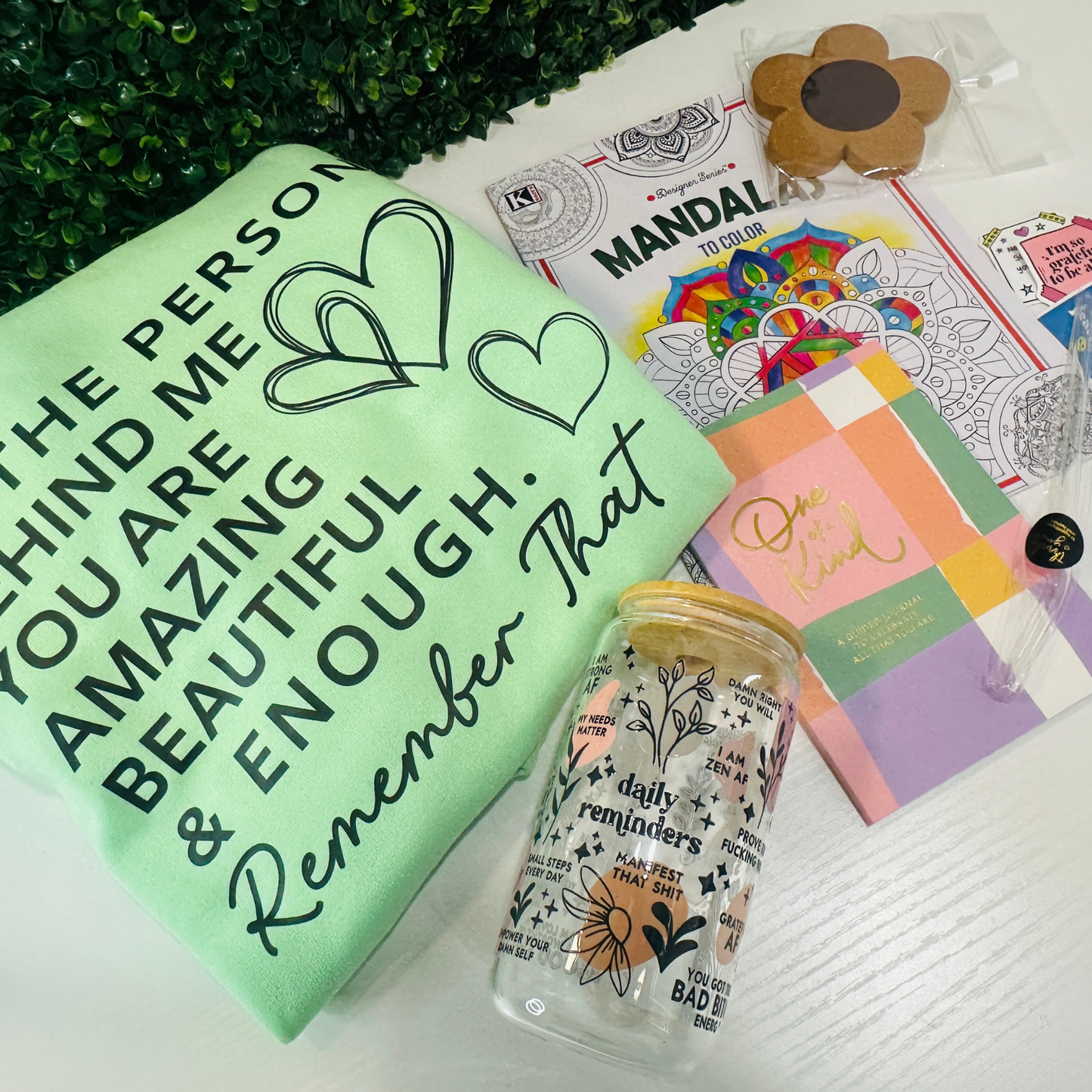 -1 (one) crewneck or hoodie with a motivational message
-1 mental health journal ( Small Size )
-1, 16oz Glass with lid and straw
- 1 mental health coloring book
-1 Coaster