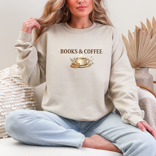 Person wearing a beige sweatshirt with 'BOOKS & COFFEE' text and graphics, sitting on a couch.