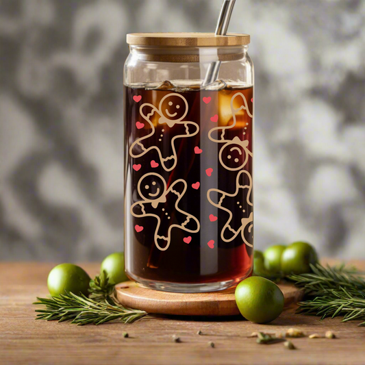 Glass tumbler with gingerbread design on a wooden table