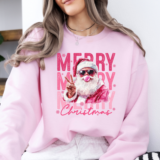 Person wearing a pink sweatshirt with a graphic of Santa Claus and 'Merry Christmas' text.