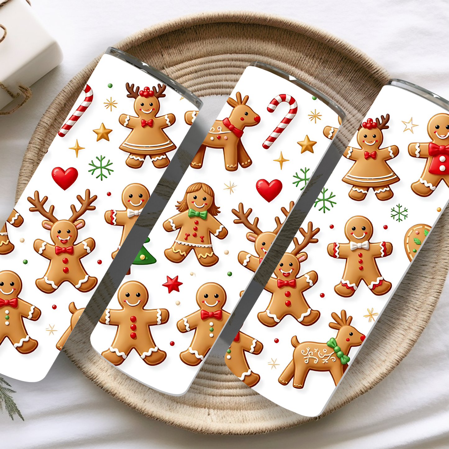 Phone case with gingerbread men and reindeer design on a woven surface
