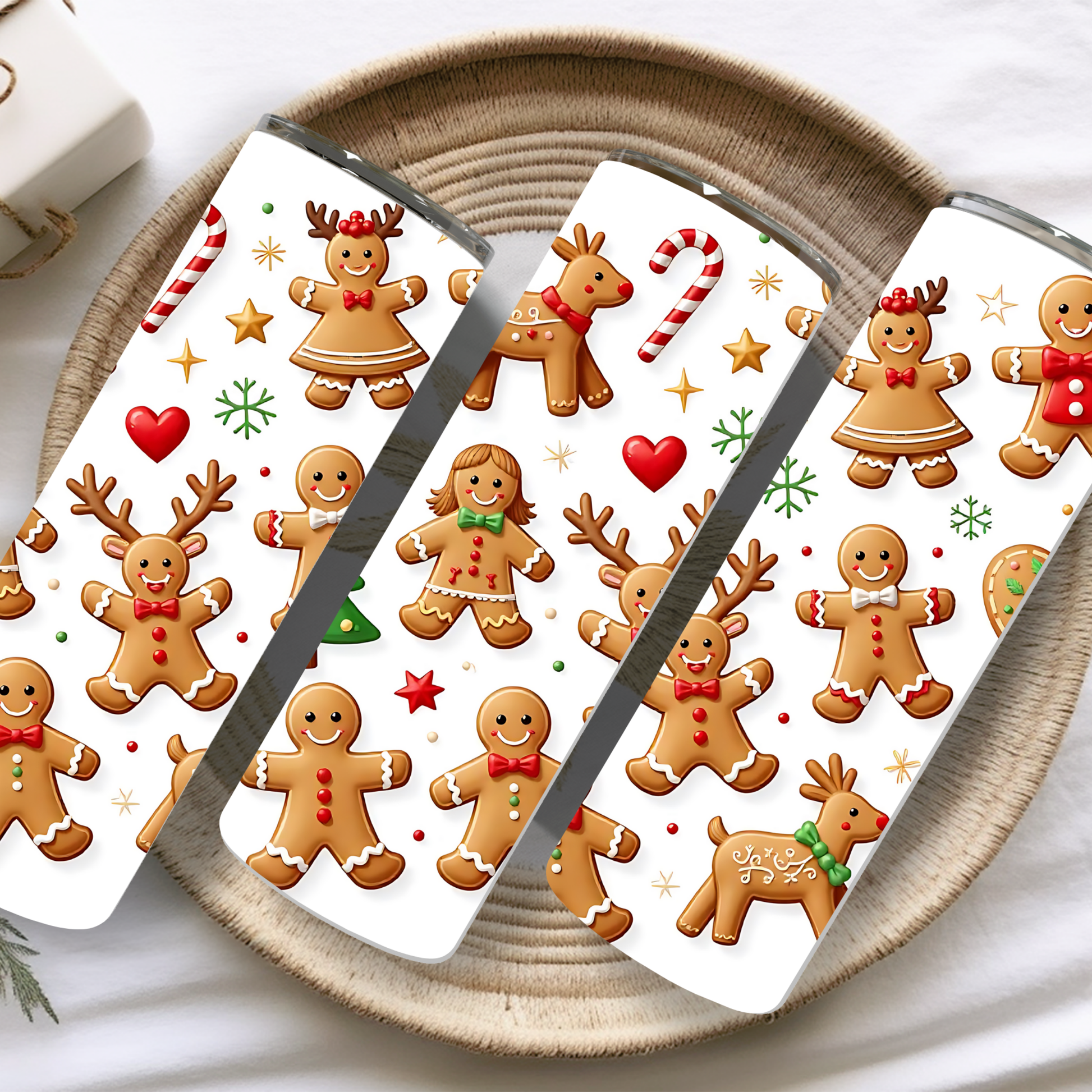 Phone case with gingerbread men and reindeer design on a woven surface
