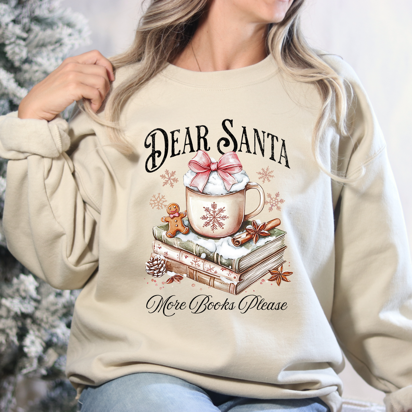 Beige sweatshirt with 'Dear Santa, More Books Please' design featuring a mug, books, and gingerbread man.