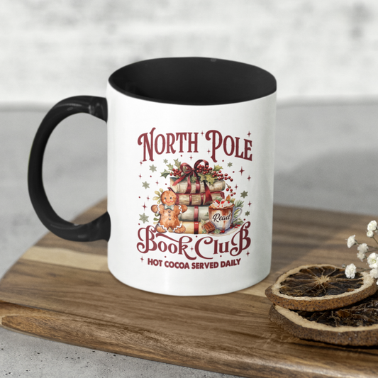 Mug with 'North Pole Book Club' design on a wooden surface