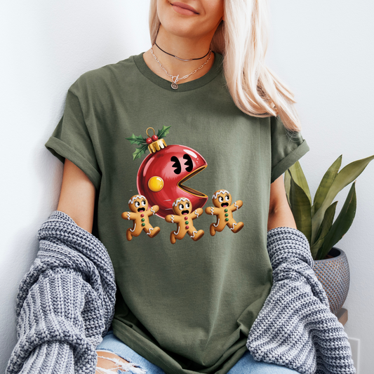 Person wearing a green t-shirt with a Christmas-themed graphic design.