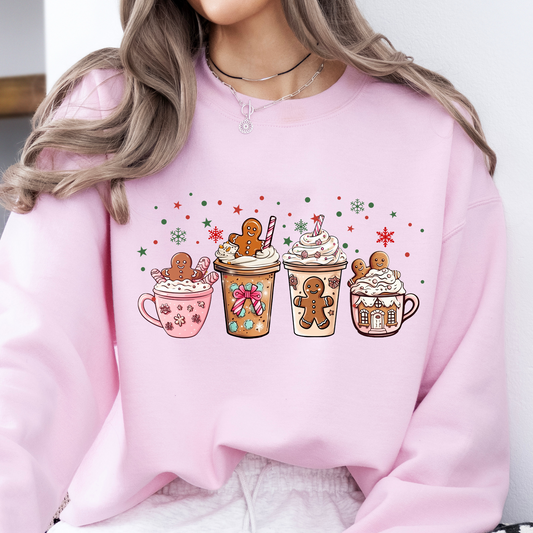 Person wearing a pink sweatshirt with festive coffee cup graphics on a white background